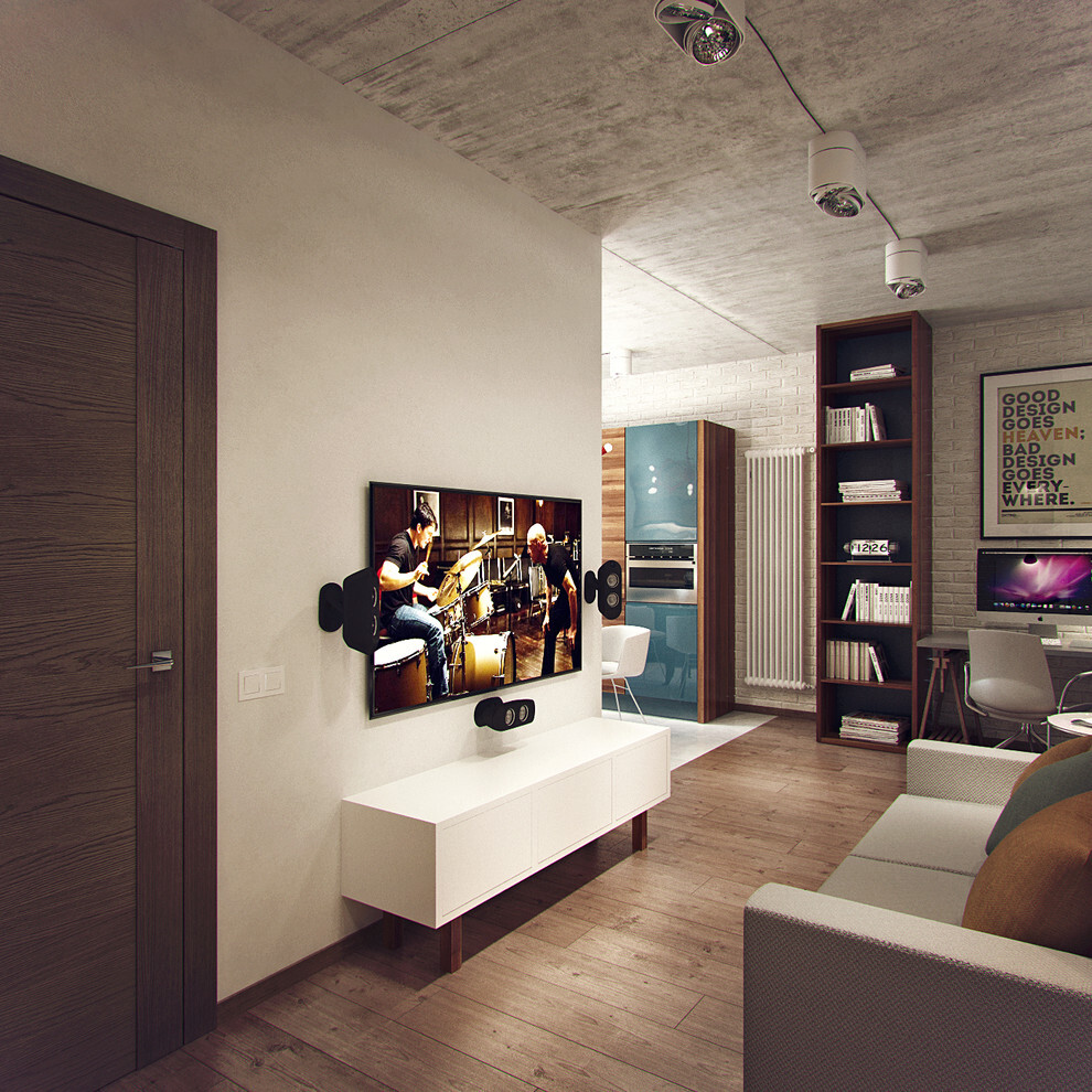 Интерьер гостиной c рабочим местом, стеной с телевизором, телевизором на стене и керамогранитом на стену с телевизором в стиле лофт