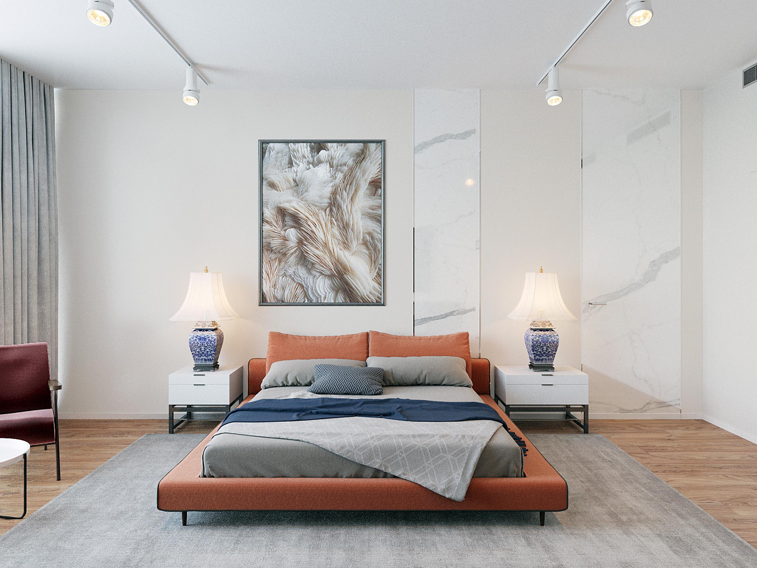 Интерьер спальни с картинами над камином в современном стиле