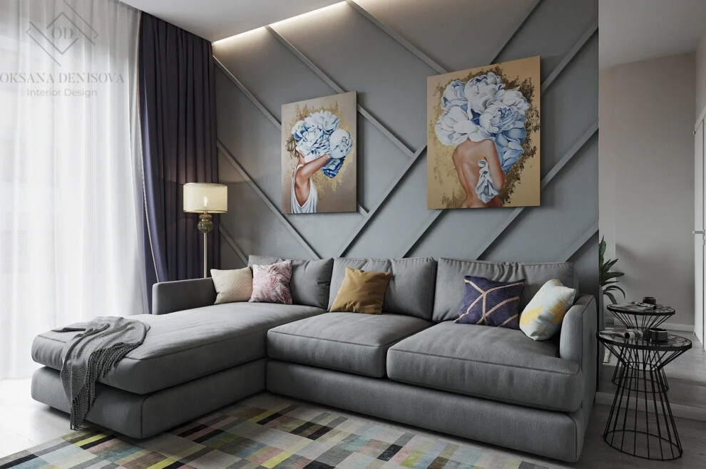 Интерьер гостиной с картинами над камином в современном стиле