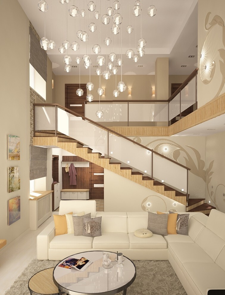 Интерьер с вторым светом, лестницей и диваном под лестницей в современном стиле